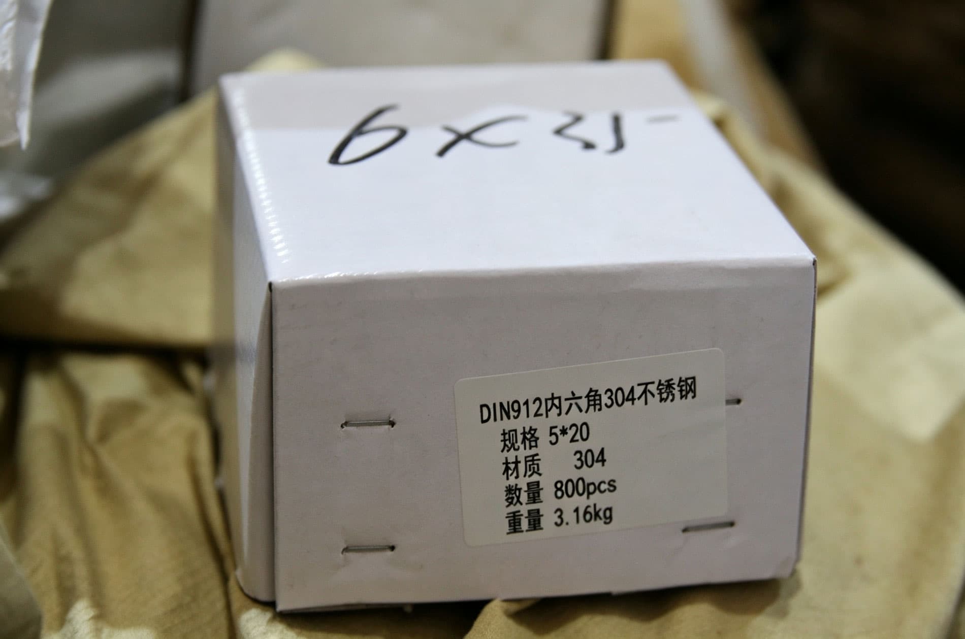 Representative fastener carton label with specification material quantity and weight fields