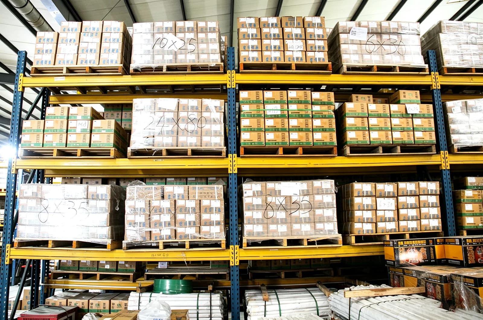 Wide view of organized fastener cartons in a partner warehouse